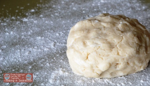 Ball of pie crust dough on work surface